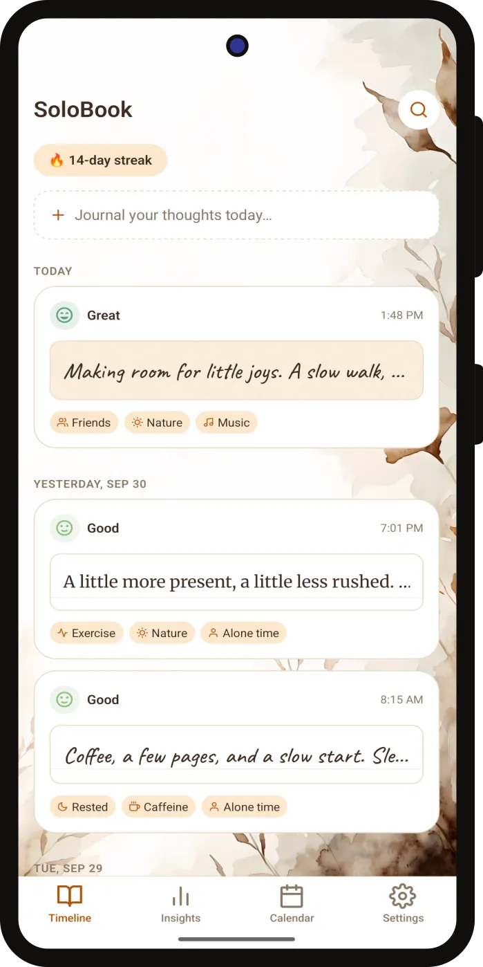 SoloBook's Timeline screen: a 14-day streak, a prompt to start writing, and the day's entries with their mood, handwritten text, and factor tags